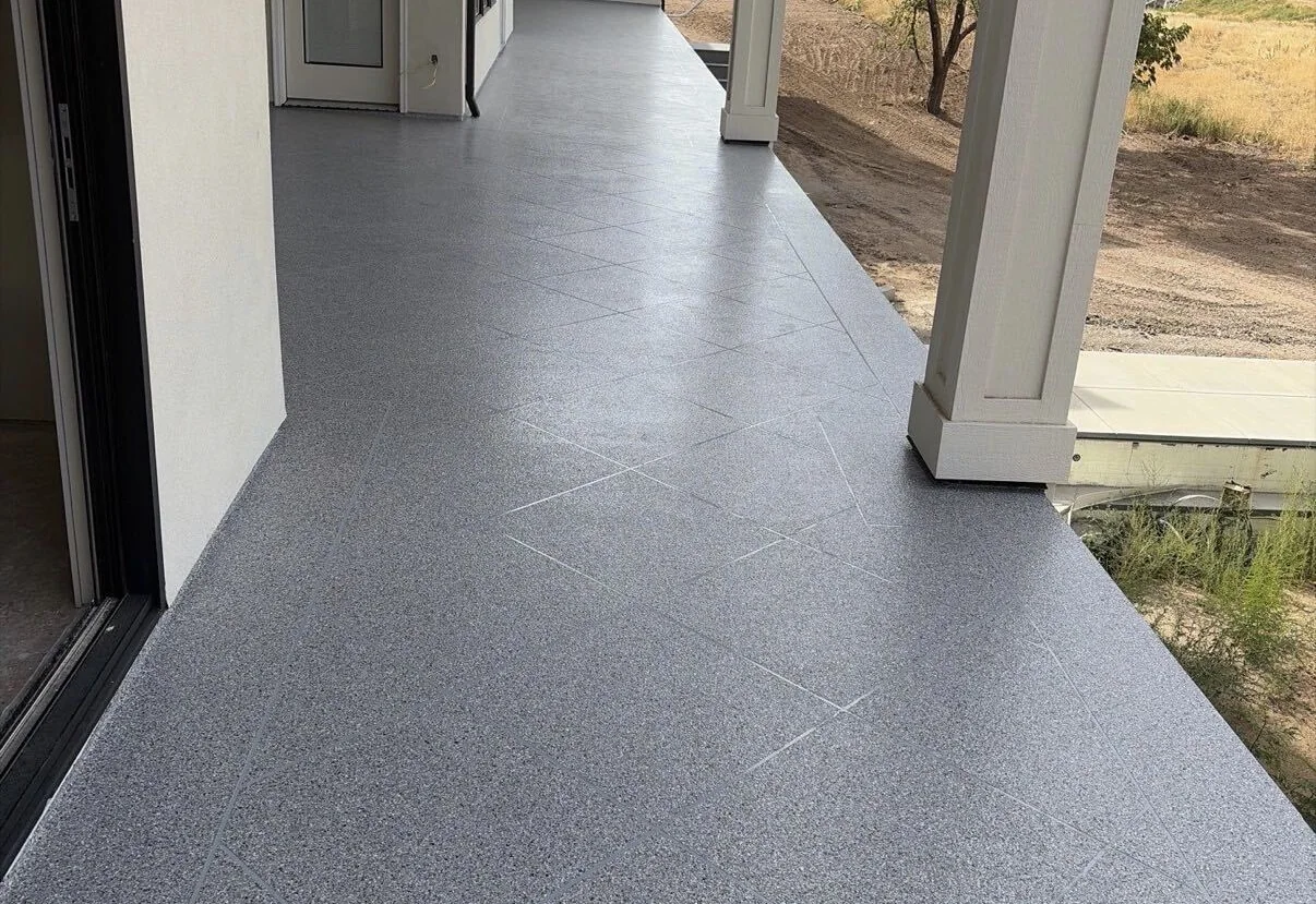 Gray flake coating with a scored pattern on a covered porch