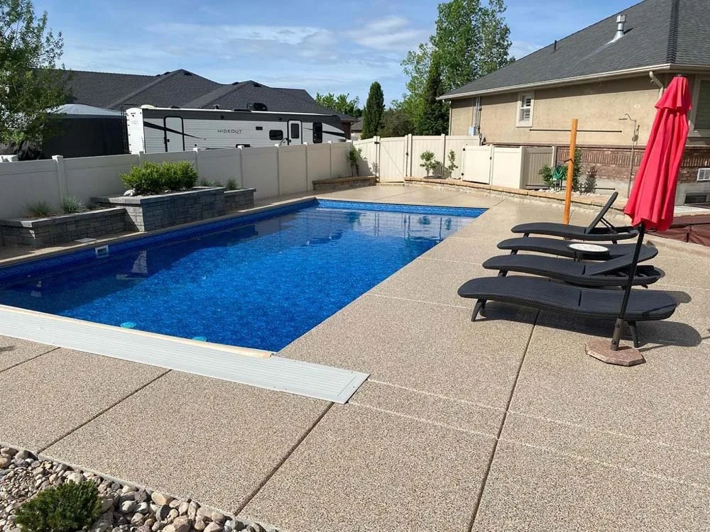 Slip resistant pool deck coating around a backyard pool
