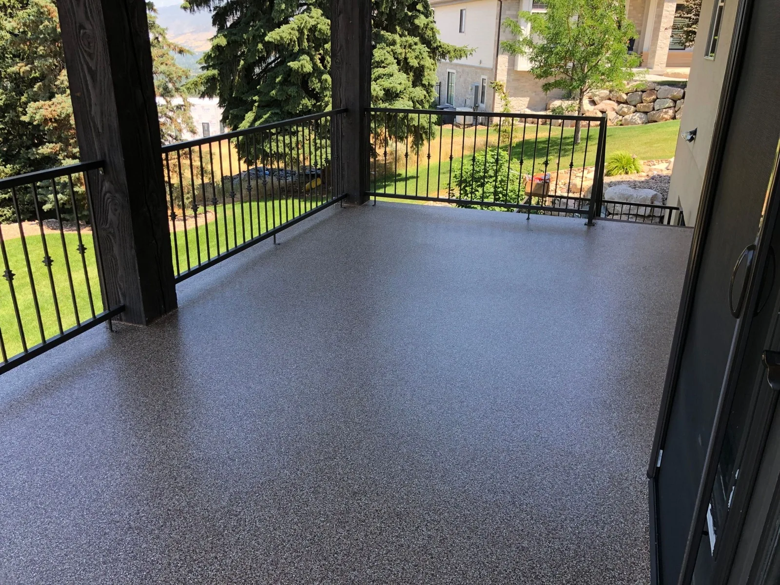 Waterproof deck coating on a covered deck